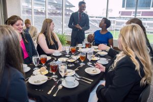Ryan Colvin, Senior Coordinator for the MSU Career Center, talks to students about dinner etiquette.